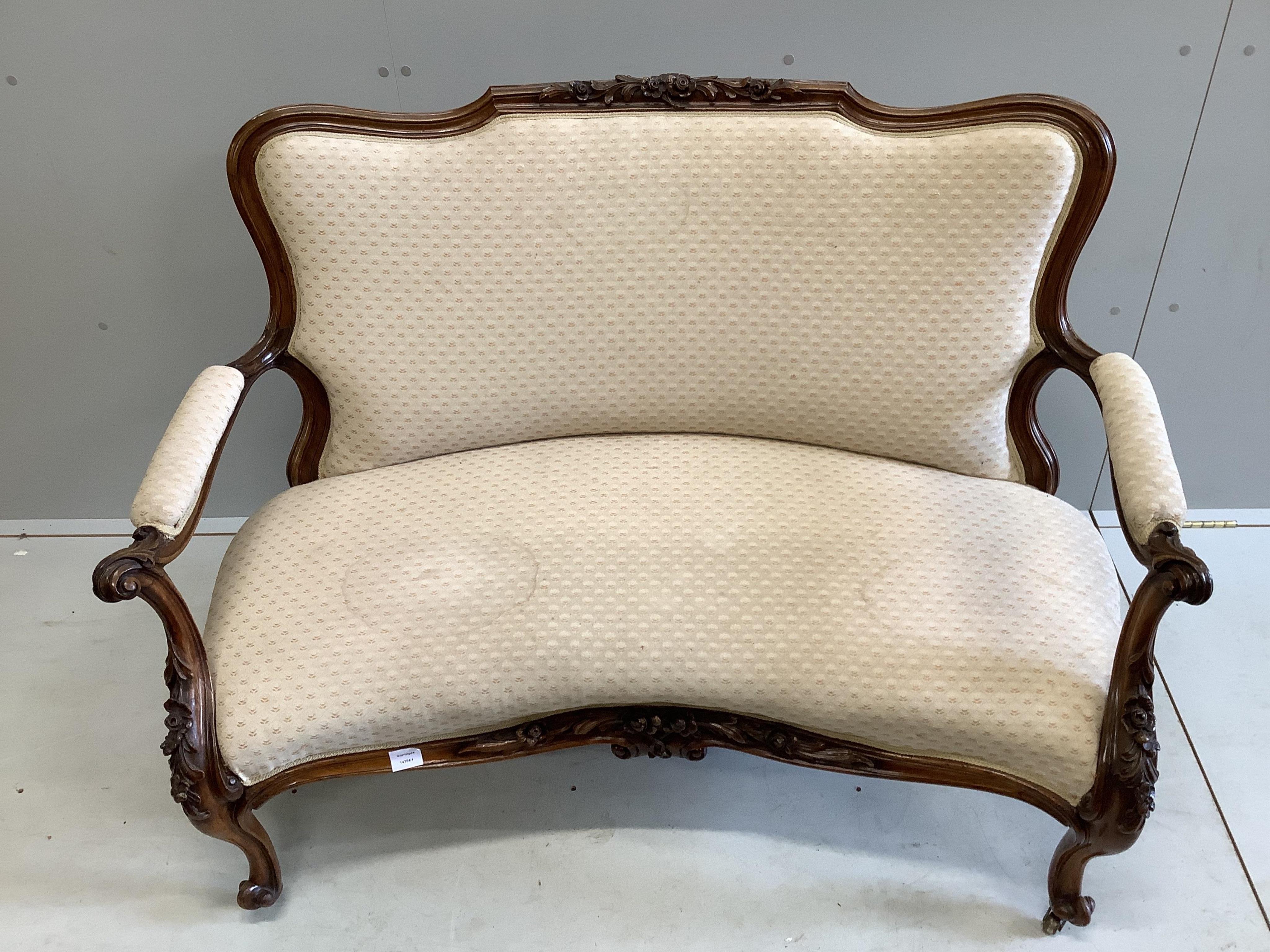 A Victorian rosewood two seater settee, width 130cm, depth 70cm, height 90cm. Condition - fair